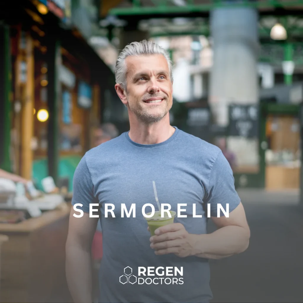 Smiling middle-aged man enjoying a green beverage while standing outdoors in a vibrant market setting. He is wearing a blue t-shirt and exudes a sense of vitality and health. The background features blurred market stalls, enhancing the lively atmosphere. The image promotes Sermorelin, a peptide used for anti-aging and hormone therapy, associated with Regen Doctors. This engaging visual represents wellness and rejuvenation, appealing to individuals interested in enhancing their health and vitality through modern medical solutions.