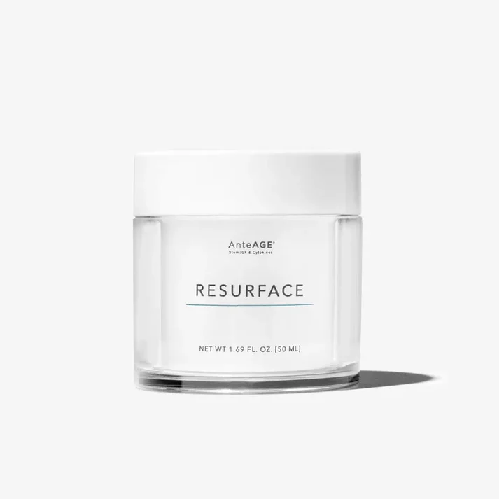 A clear glass jar of skincare cream labeled "Resurface" sits on a plain white background. The jar's minimalist design features a sleek white lid and simple text, emphasizing its modern and elegant aesthetic. This product is designed to promote skin renewal and improve texture, making it suitable for various skin types. Ideal for daily use, it aims to enhance the overall appearance of the skin, providing hydration and radiance. Perfect for individuals seeking effective skincare solutions, this cream is a key addition to any beauty routine